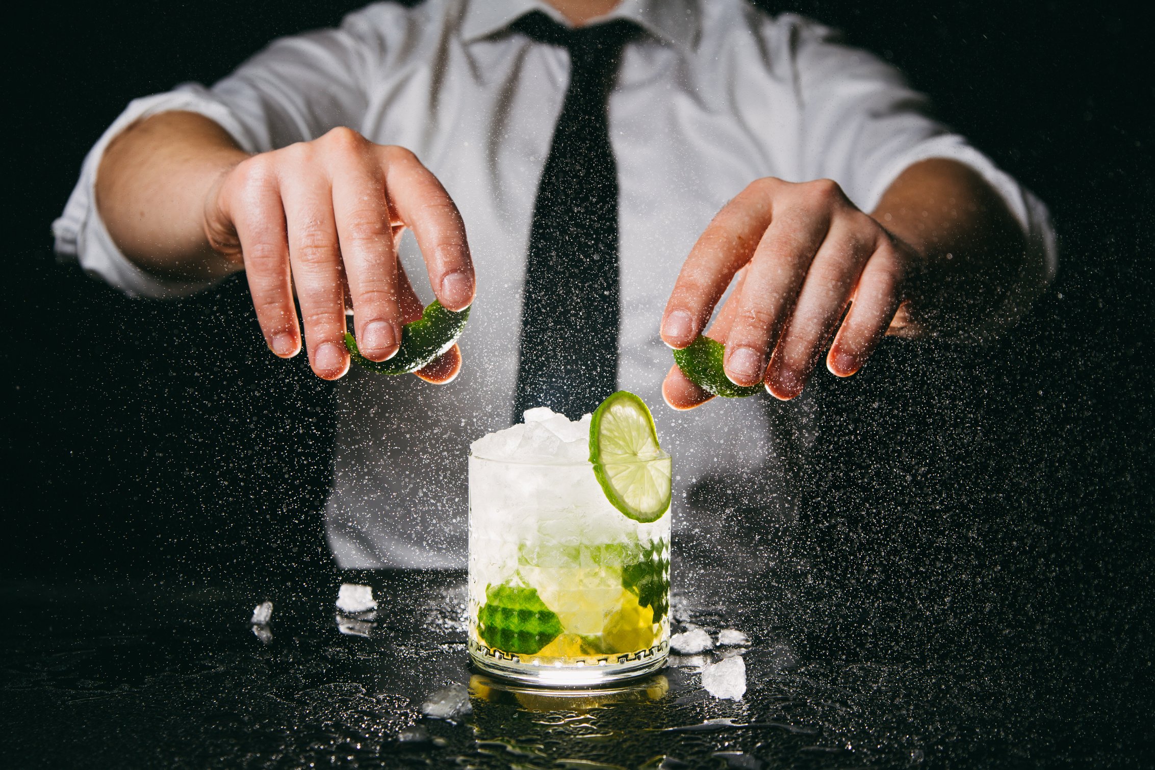 Barman preparing caipirinha cocktail